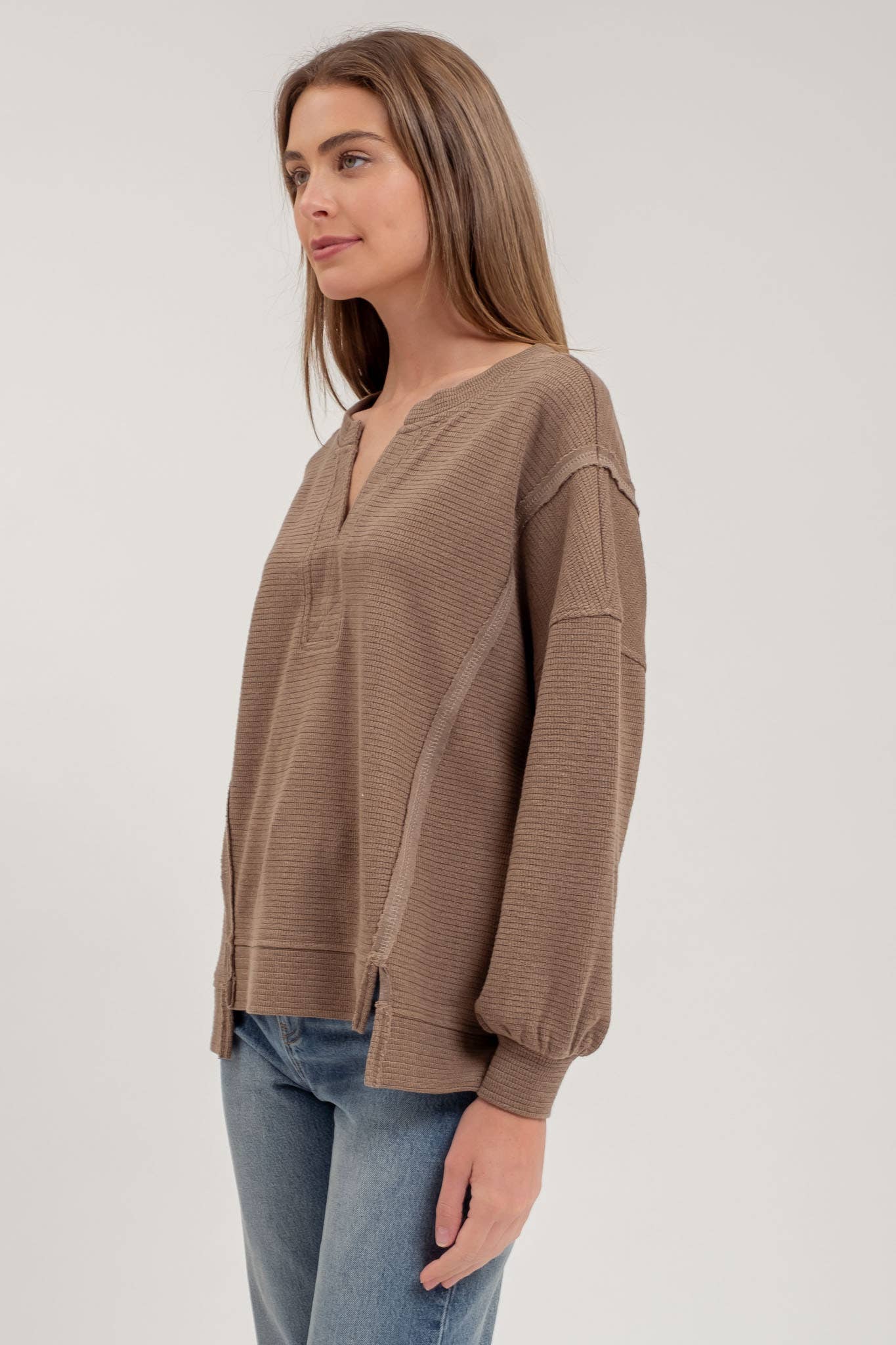 SPLIT NECK EXPOSED SEAM LONG SLEEVE KNIT TOP