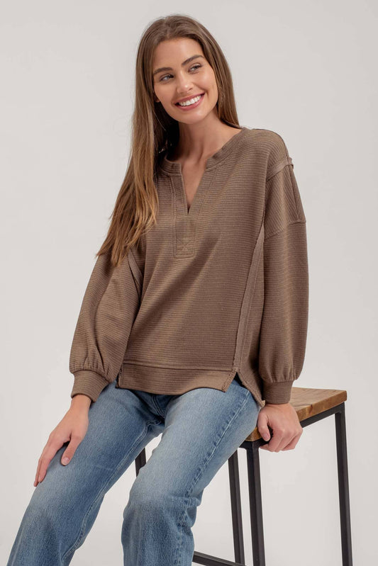 SPLIT NECK EXPOSED SEAM LONG SLEEVE KNIT TOP